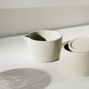 white ceramic pitcher on white table