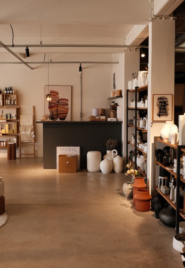 A stylish shop interior displays various home goods.